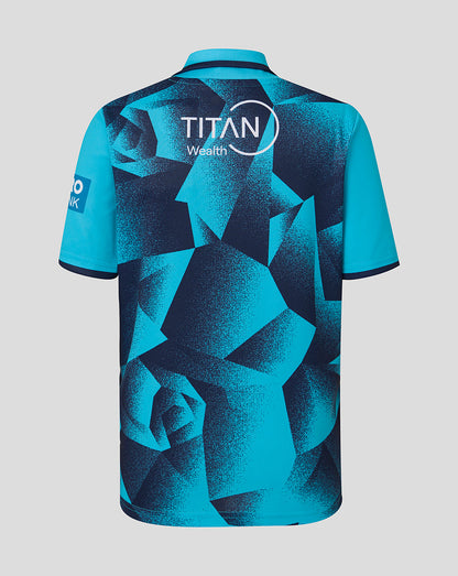 Blue sports jersey with geometric pattern and 'Titan Wealth' branding on a light gray background