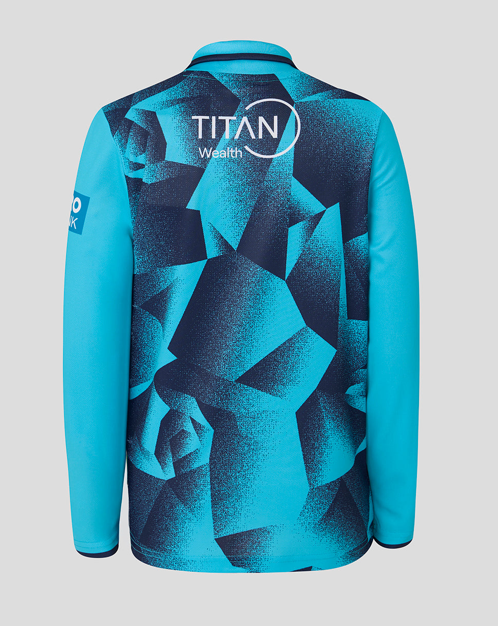 Blue sports jersey with geometric pattern and Titan Wealth logo on a gray background