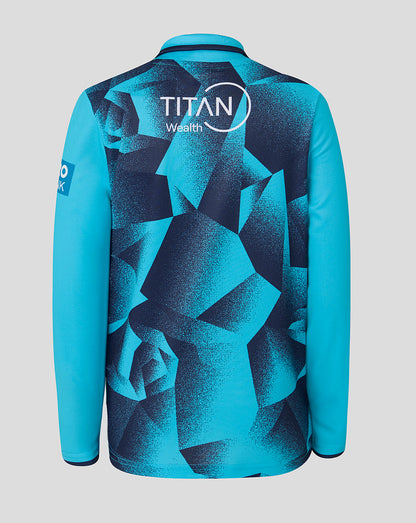 Blue sports jersey with geometric pattern and Titan Wealth logo on a gray background