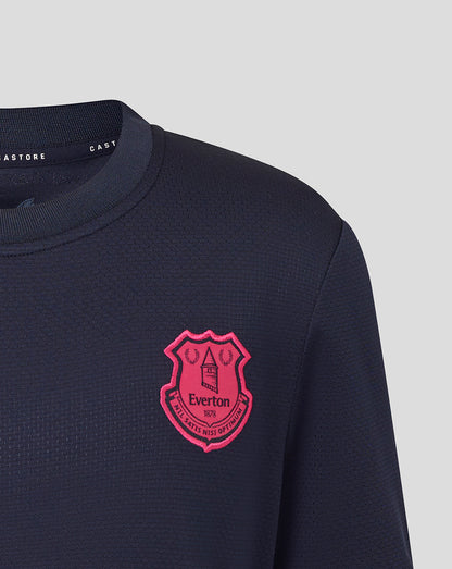 Navy blue t-shirt with a pink crest logo on a light gray background