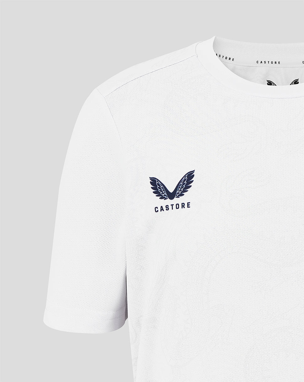 White t-shirt with a logo and text on a light gray background