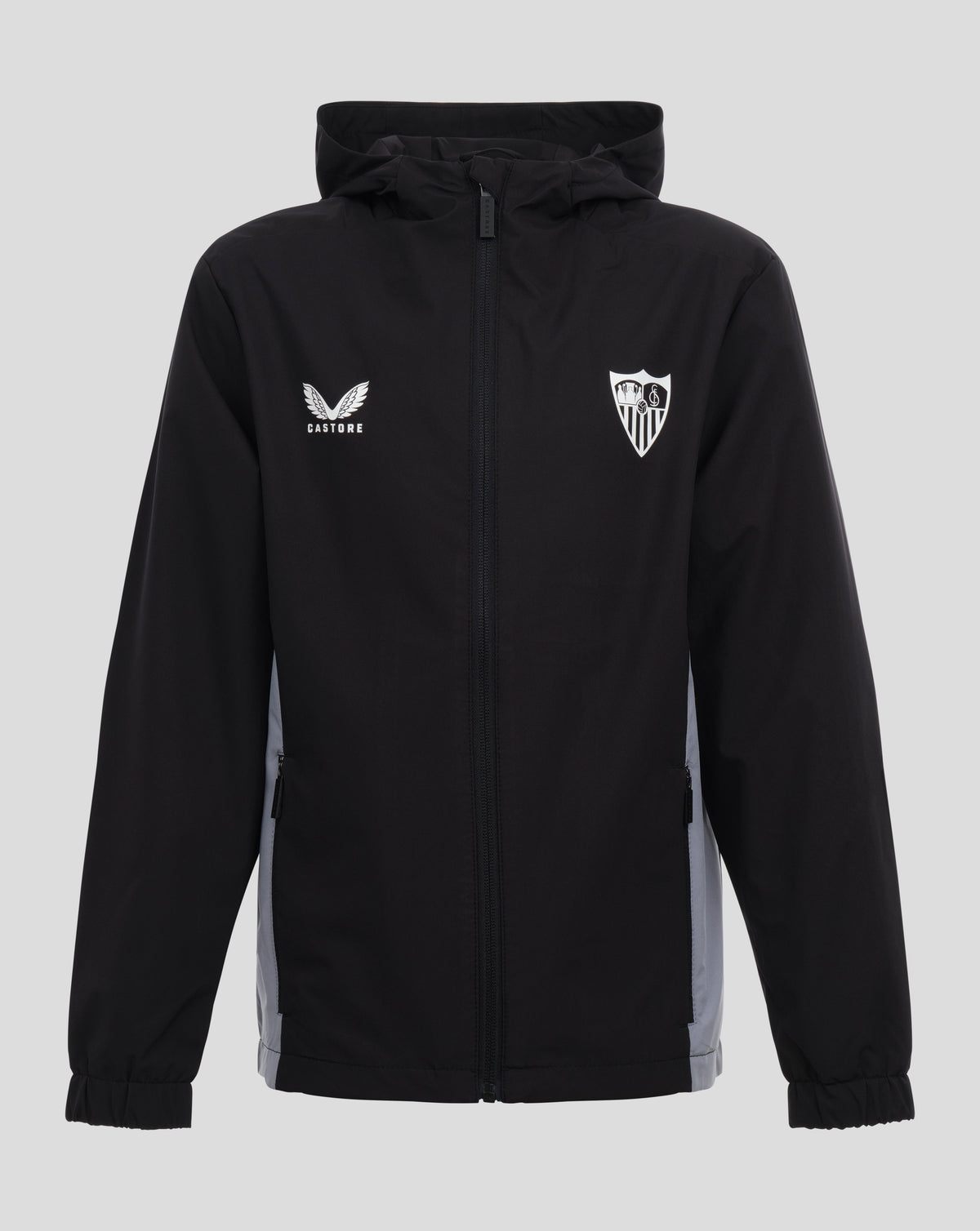 Front view of black Sevilla Junior Training Coaches lightweight jacket with hood, white Castore logo on left chest and Sevilla crest on right
