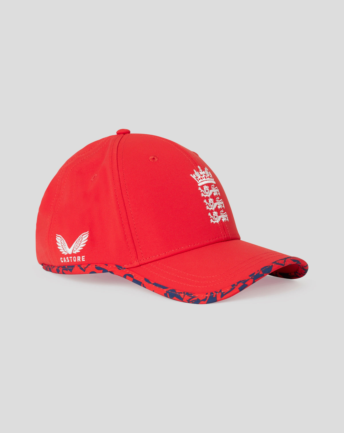 Front view of fiery red England cricket junior T20 cap with white crest on the front and a blue patterned brim.