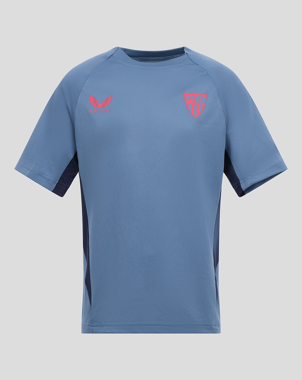Sevilla junior 24/25 training shirt in light blue with pink club crest and pink Castore logo