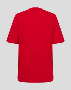 Back view of the red Almeria Junior Crest shirt showing plain fabric and straight hem