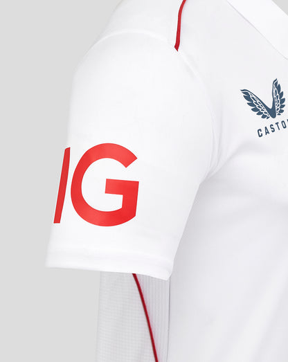 White sports jersey with red and black logos on a white background