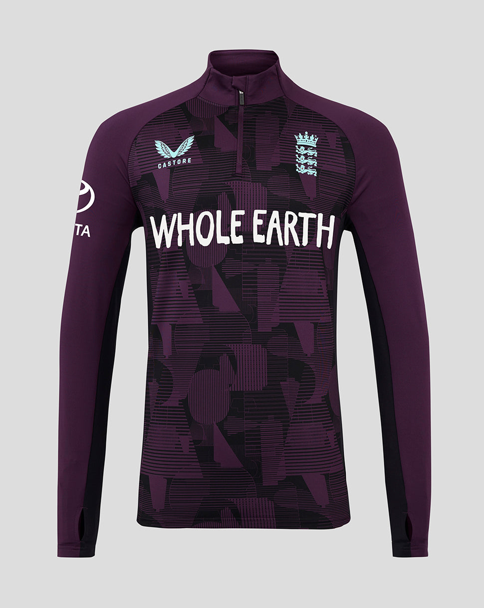 Purple athletic long-sleeve shirt with 'Whole Earth' branding on a gray background