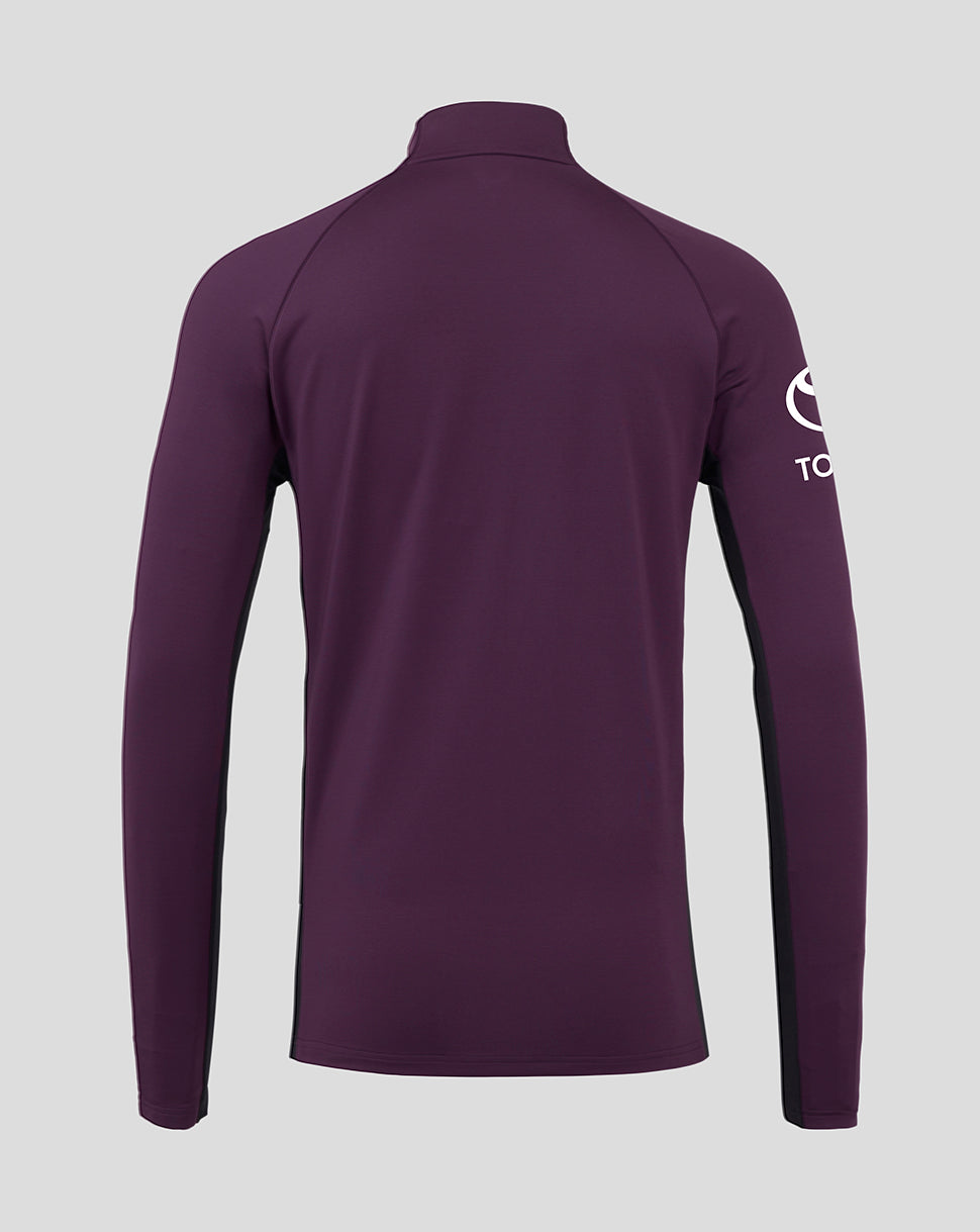 Purple long-sleeve shirt with a brand logo on the sleeve against a light gray background