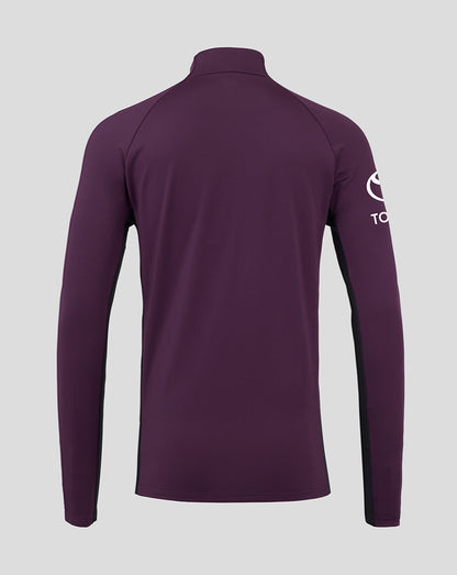 Purple long-sleeve shirt with a brand logo on the sleeve against a light gray background