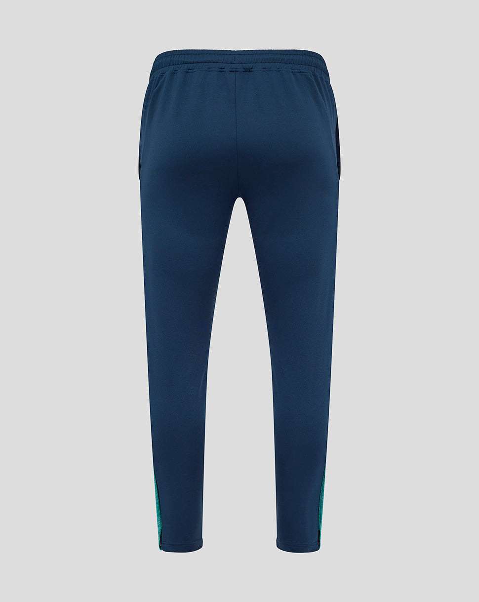Back view of navy Athletic Club training pants with teal side panels and an elastic waistband