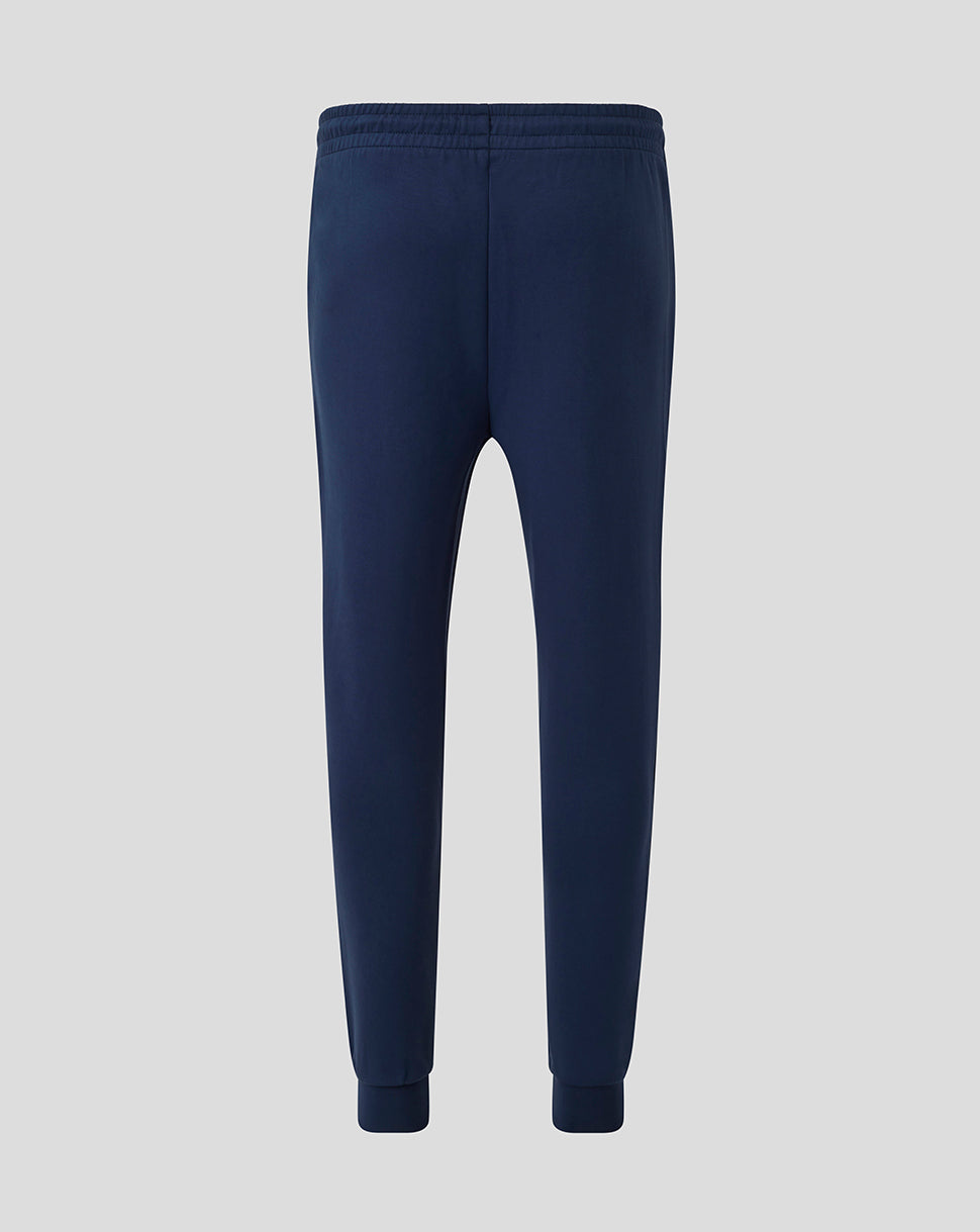 Back view of navy Athletic Club men's travel knit pants with an elastic waistband and ribbed cuffs.