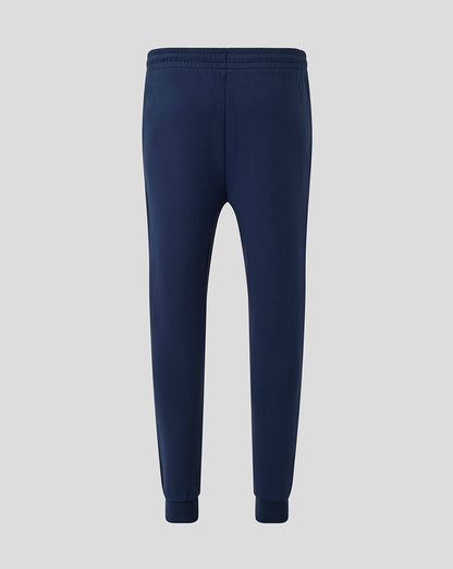 Back view of navy Athletic Club men's travel knit pants with an elastic waistband and ribbed cuffs.