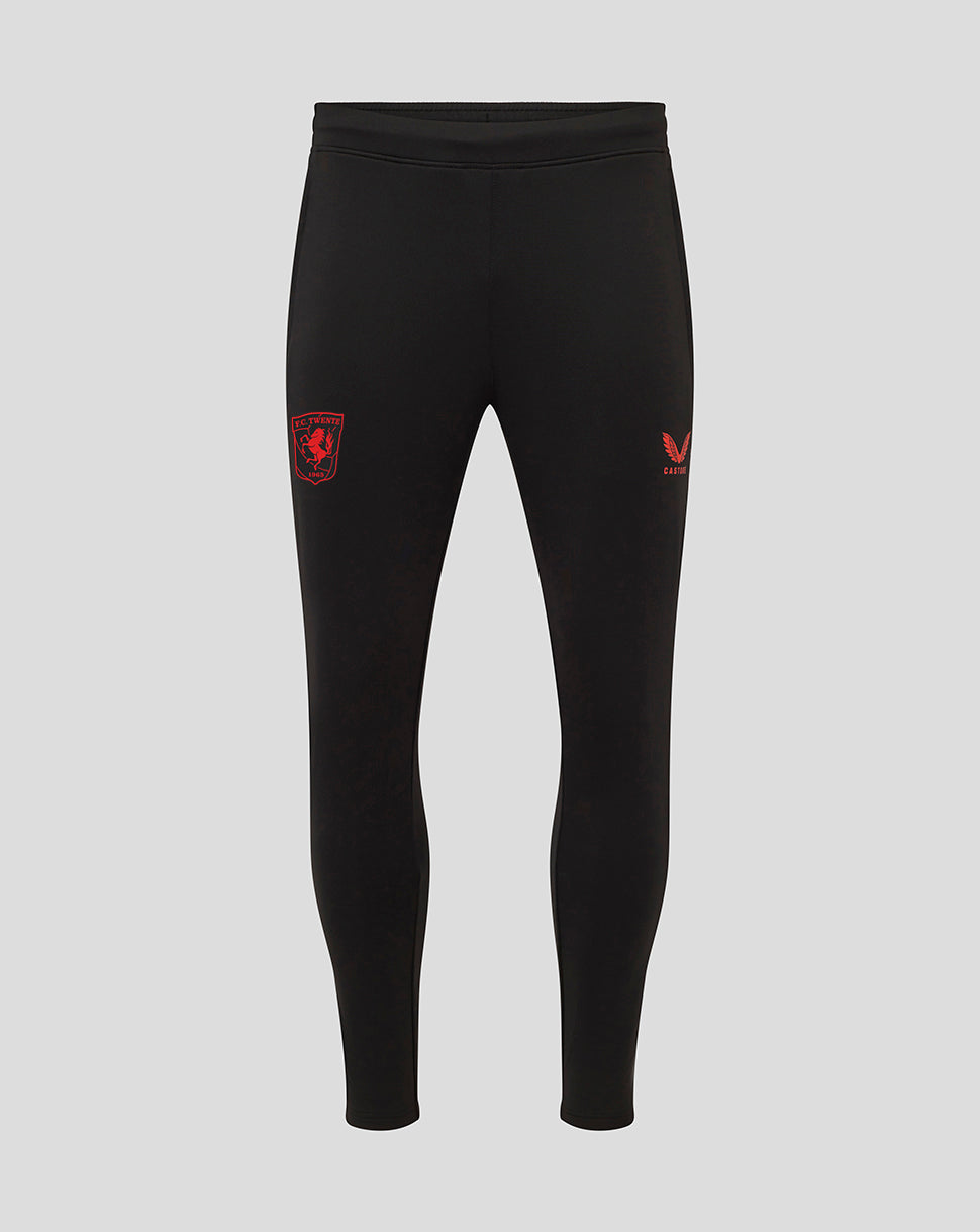 Front view of black FC Twente performance pants showing a red crest on the left thigh and a Castore emblem on the right thigh.