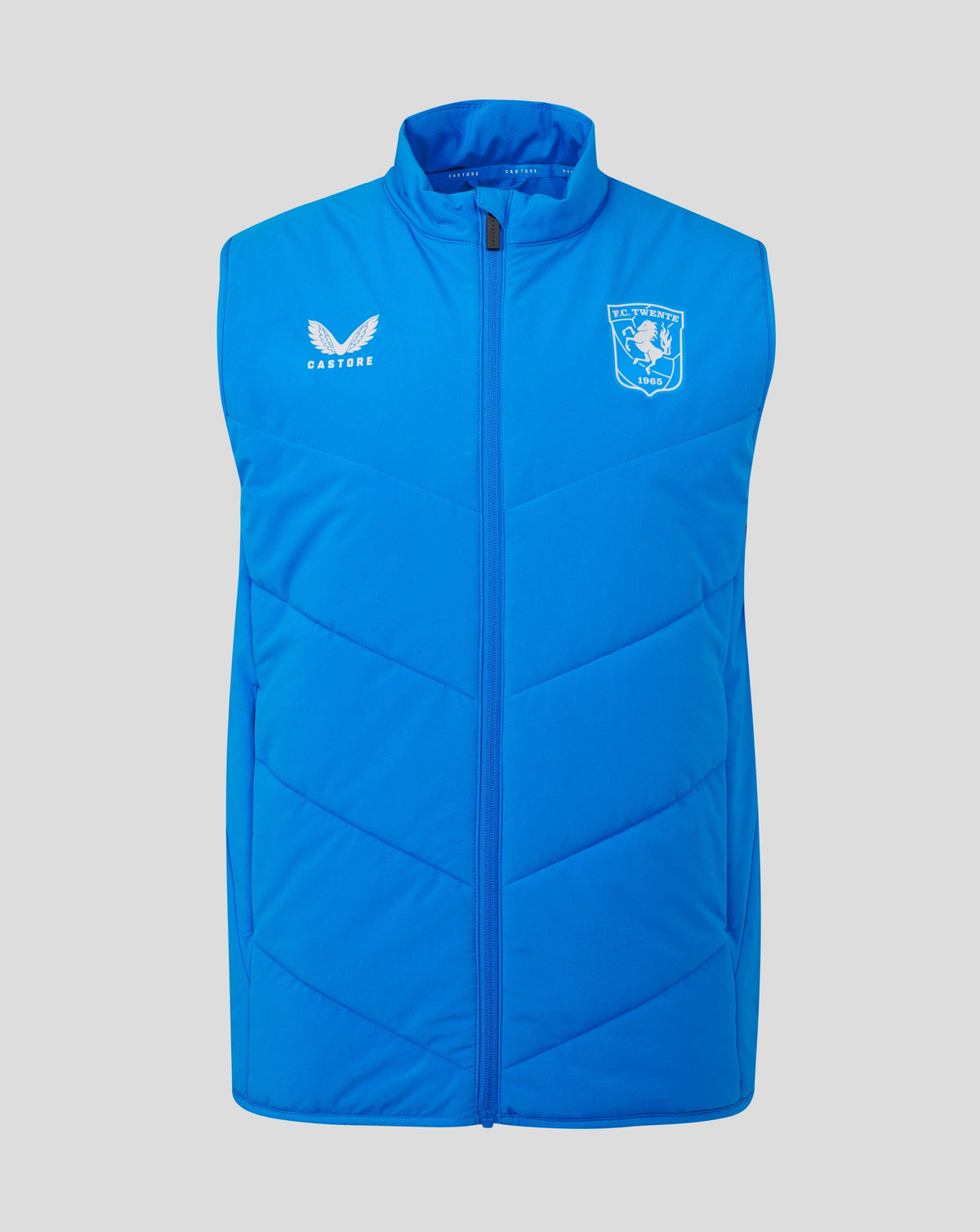Bright blue FC Twente gilet with white Castore logo on the left chest and FC Twente crest on the right, full front zip
