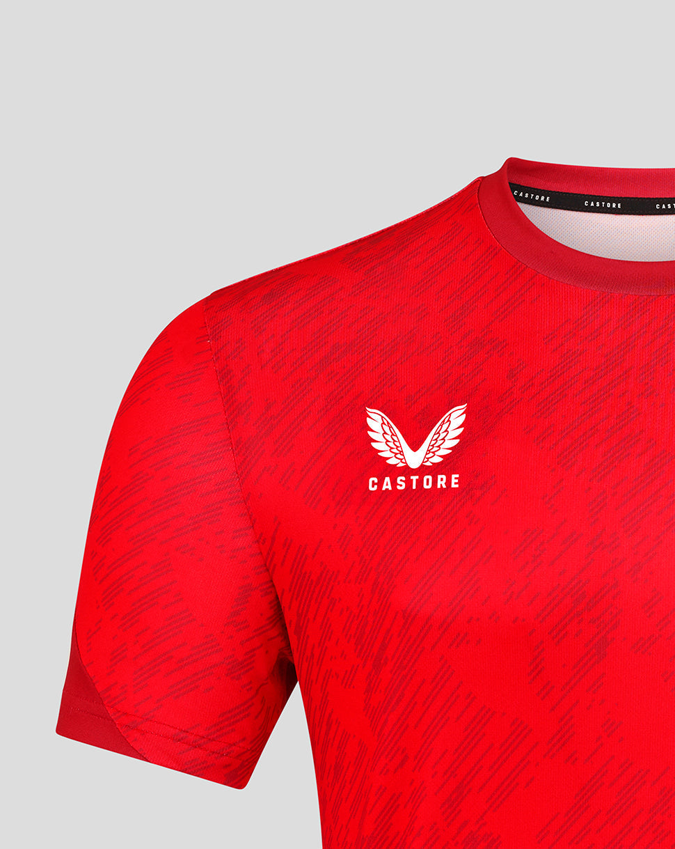 Close up of red FC Twente matchday T shirt showing the chest crest and Castore branding at the collar