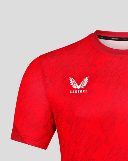 Close up of red FC Twente matchday T shirt showing the chest crest and Castore branding at the collar