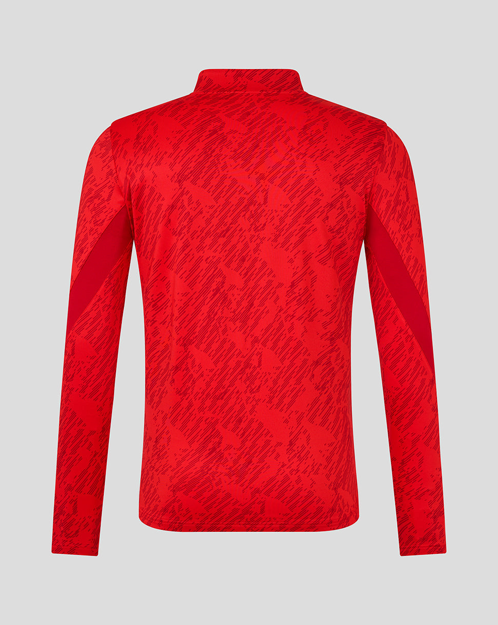 Back view of red FC Twente matchday midlayer top with a dark brush pattern.