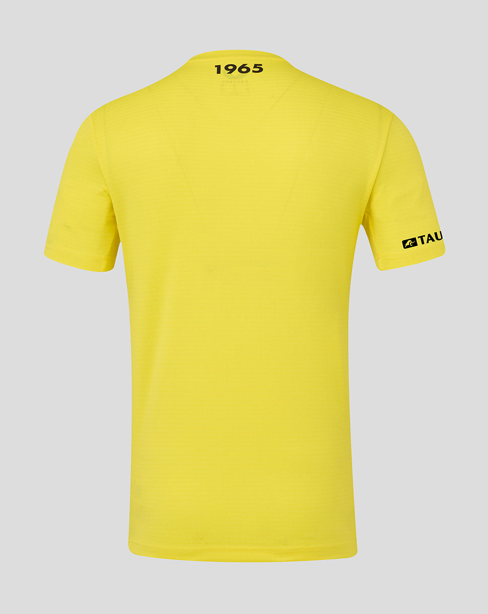 Yellow t-shirt with text on the back and sleeve against a gray background