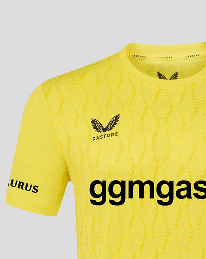 Yellow sports jersey with branding on a gray background