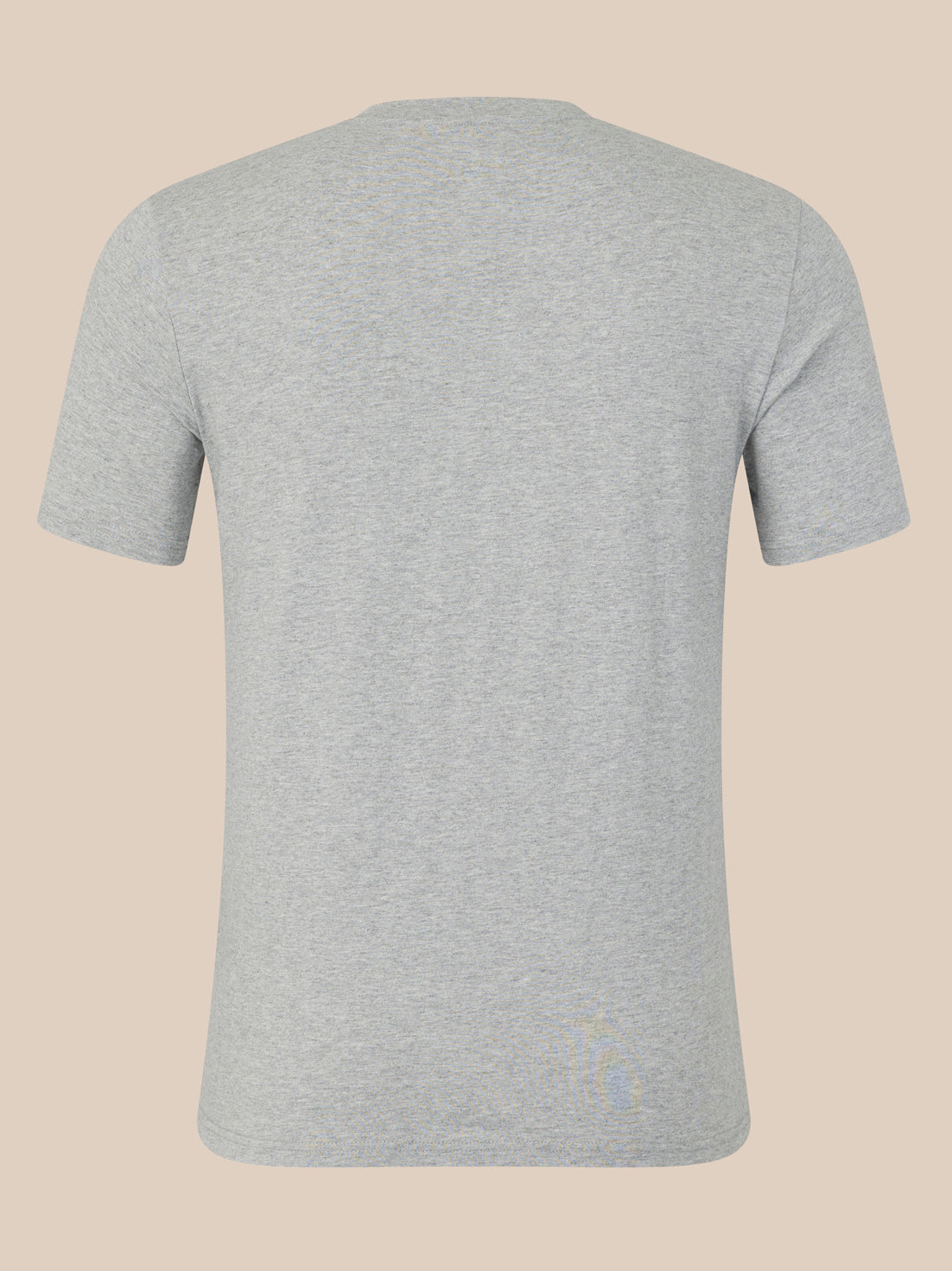 Gray t-shirt on a beige background
