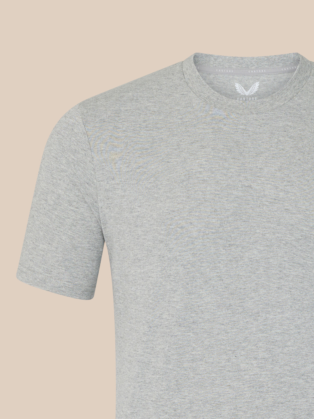 Gray t-shirt on a beige background
