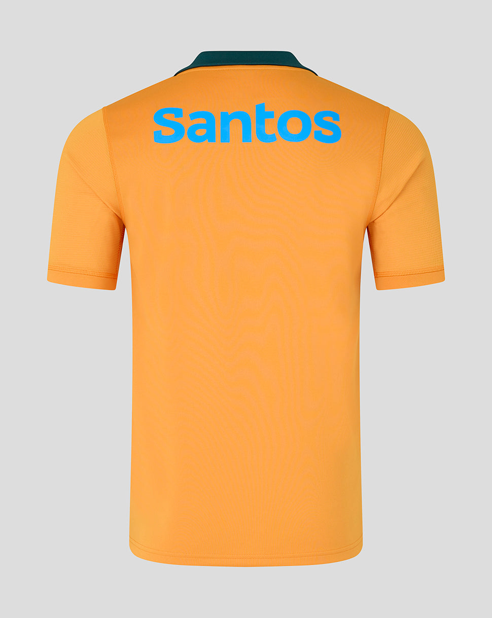 Orange polo shirt with 'Santos' branding on the back against a gray background