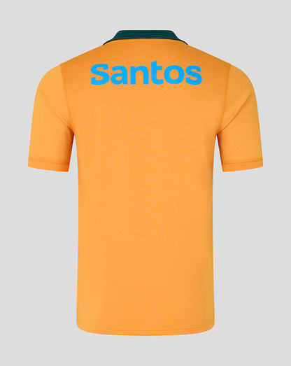 Orange polo shirt with 'Santos' branding on the back against a gray background