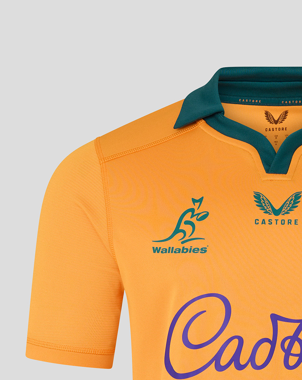 Orange sports jersey with green collar and visible branding on a gray background