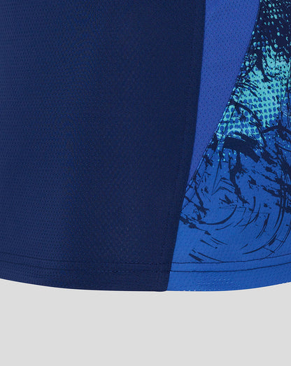 Blue athletic shorts with a patterned design on a light gray background