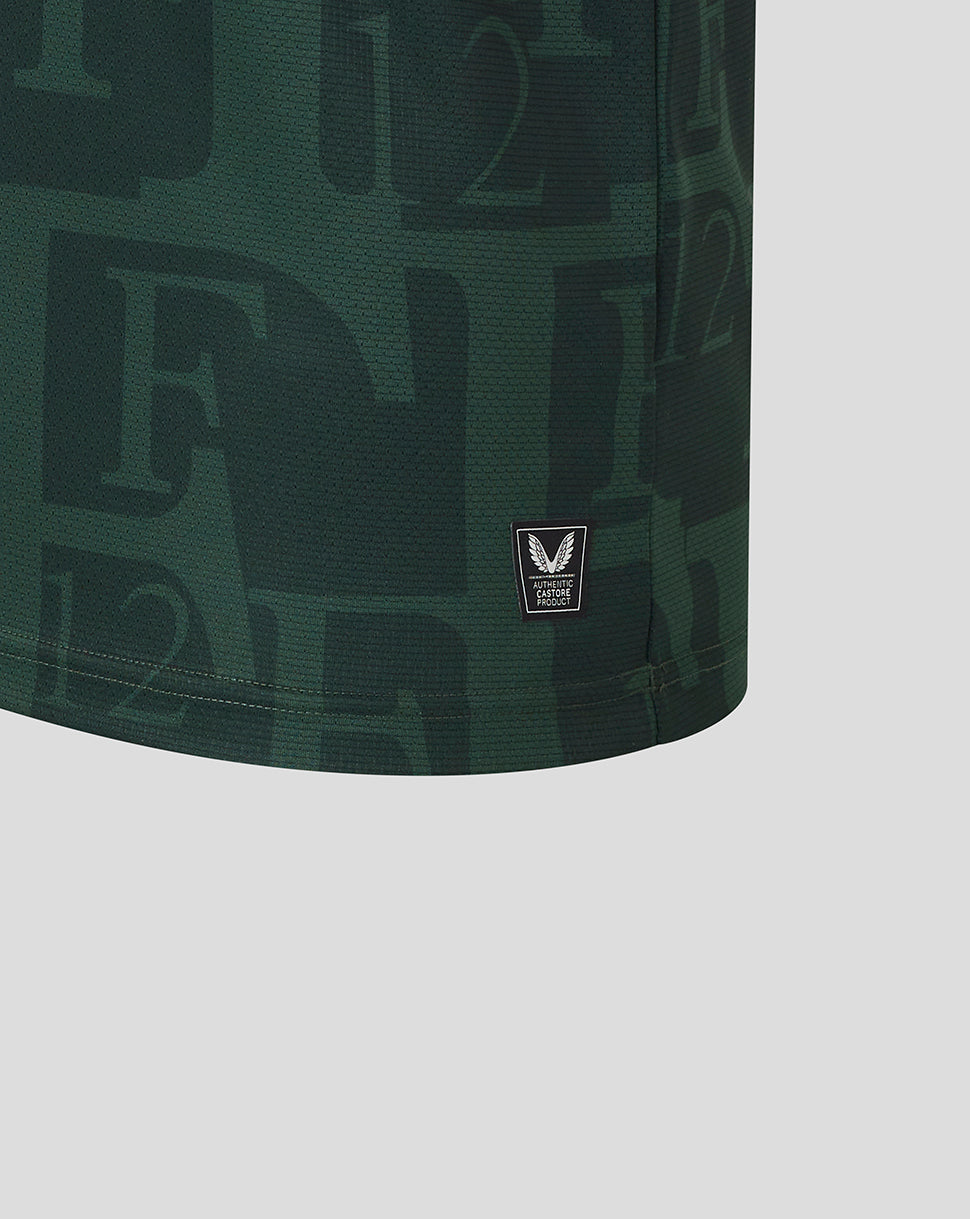 Close-up of dark green Feyenoord jersey fabric with a small Castore authentication patch at the hem