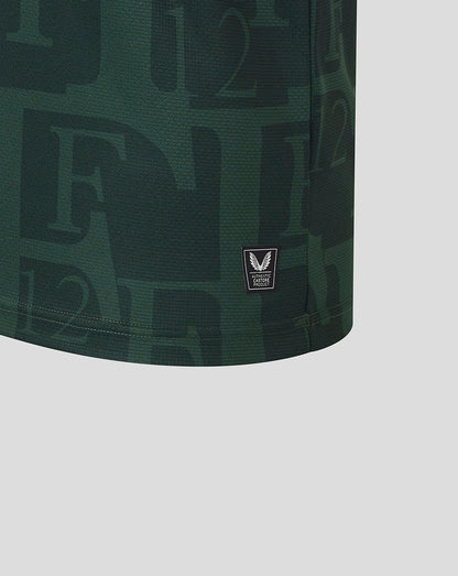 Close-up of dark green Feyenoord jersey fabric with a small Castore authentication patch at the hem