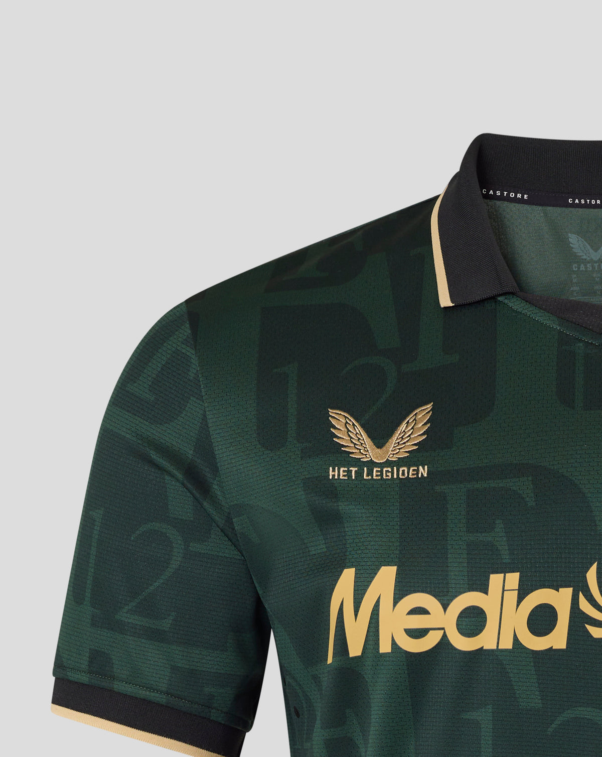 Collar area close-up of the dark green Feyenoord jersey with black collar and gold trim, Castore branding visible at the neckline.