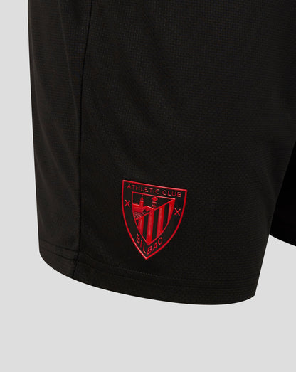 Front view of black shorts with light blue side panels, zip pockets, club crest on left leg and Castore logo on right.
