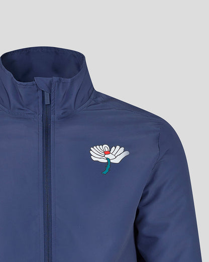 Blue jacket with a white logo on a light gray background