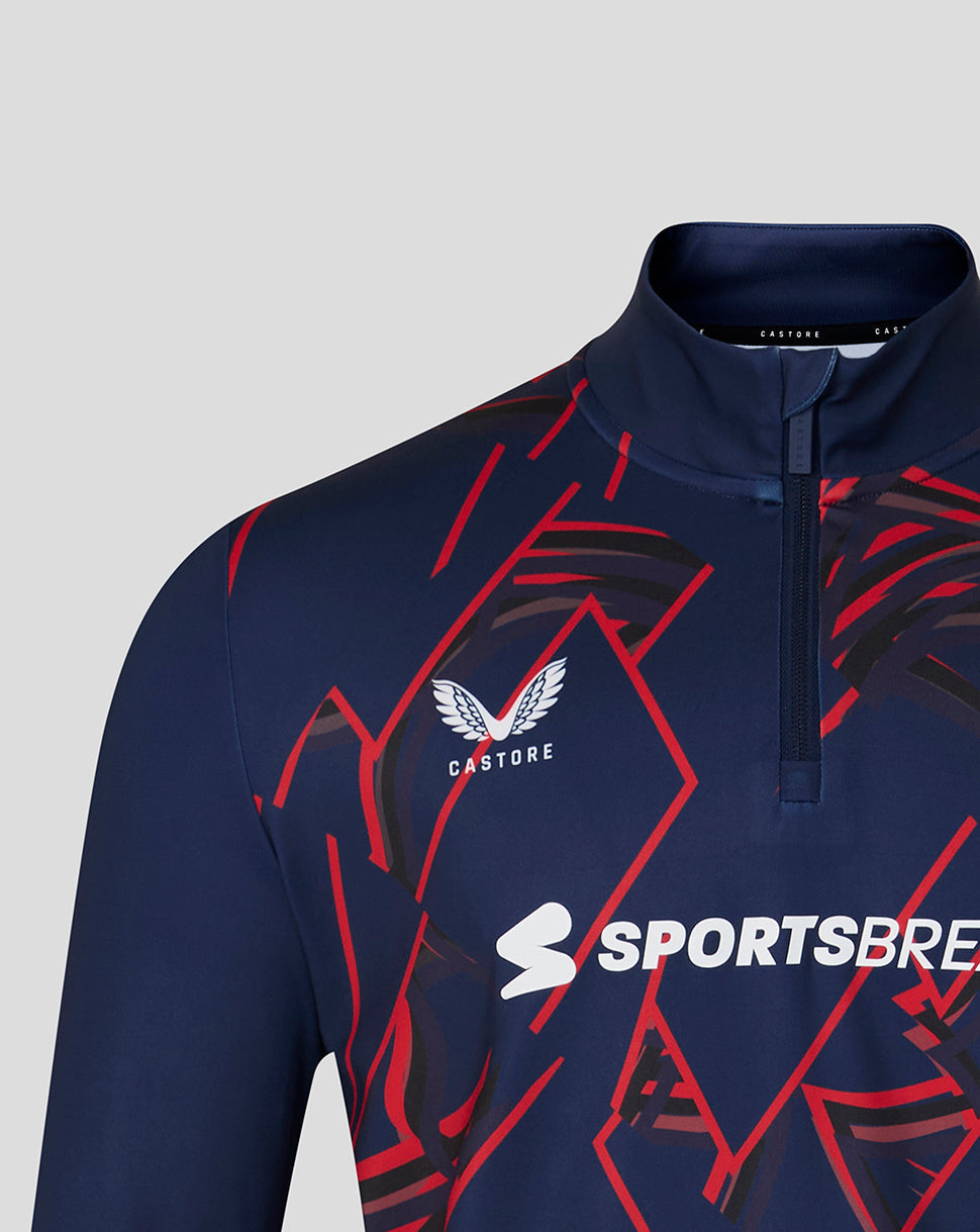 Navy sports jacket with red patterns and visible branding on a gray background