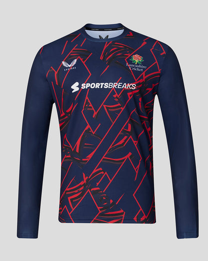 Navy long-sleeve sports shirt with red patterns and visible branding on a gray background