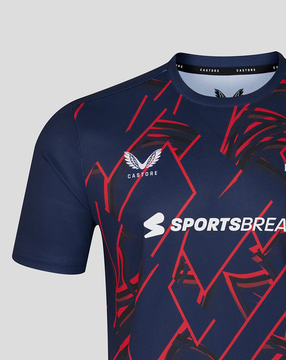 Navy blue sports jersey with red and white patterns on a gray background