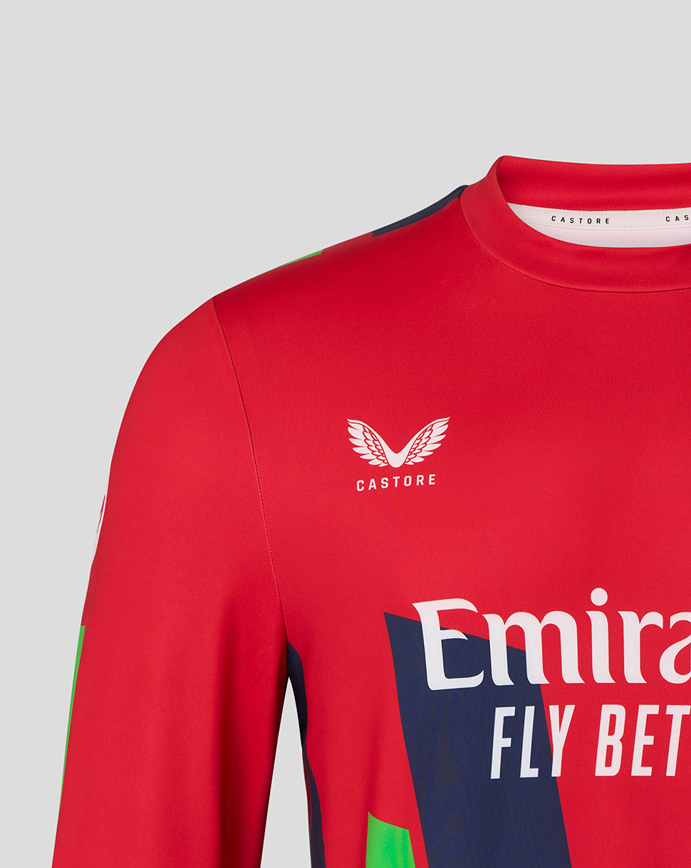Red sports jersey with Castore and Emirates branding on a gray background