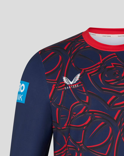 Navy long-sleeve shirt with red rose pattern and visible brand logo on a light gray background