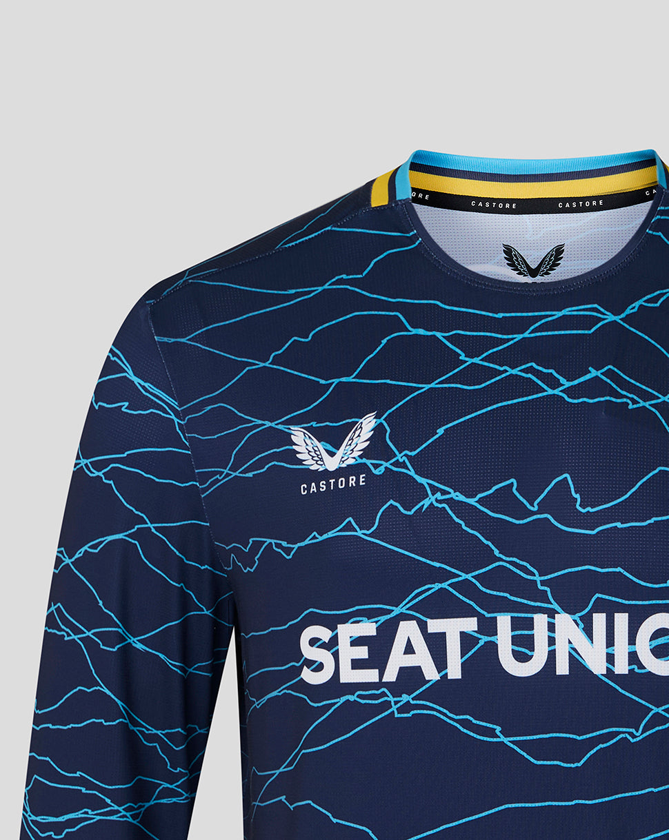 Navy sports jersey with blue patterns and 'Castore' branding on a gray background