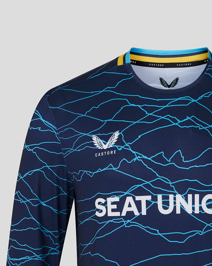 Navy sports jersey with blue patterns and 'Castore' branding on a gray background