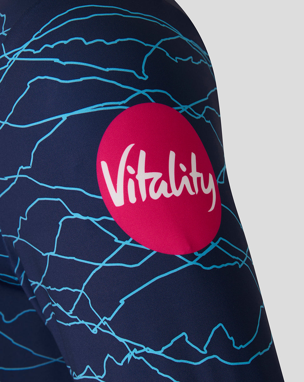 Navy blue sleeve with white abstract patterns and a red circle with 'Vitality' logo on a light gray background