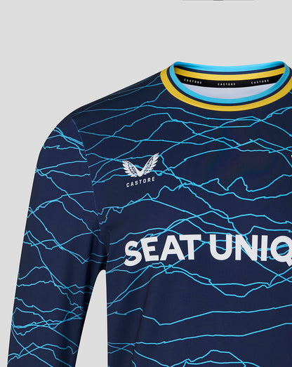 Navy long-sleeve shirt with blue pattern and 'Castore' branding on a gray background