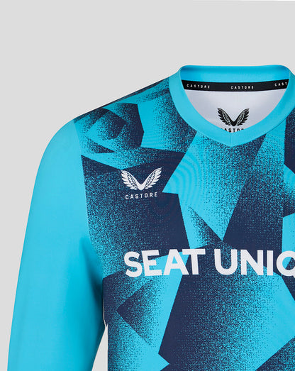 Blue sports jersey with geometric pattern and visible branding on a light gray background