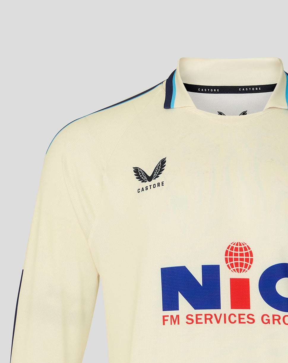 Beige sports jersey with logos on a gray background