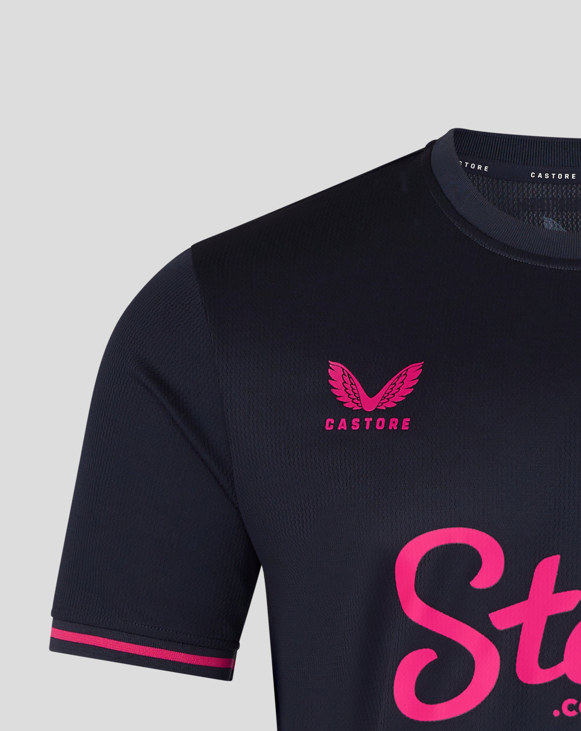 Black sports jersey with pink branding on a light gray background