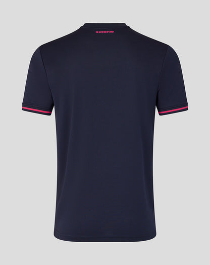 Navy blue polo shirt with pink accents on a light gray background