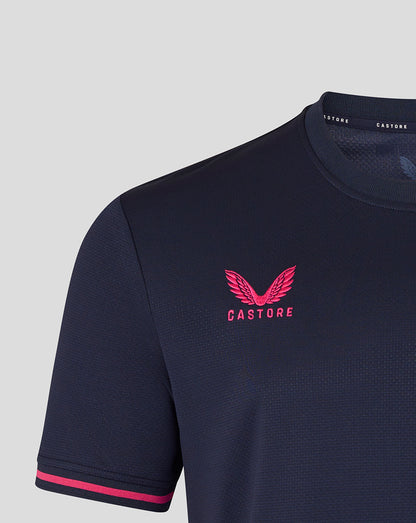 Navy blue t-shirt with pink logo and text on a light gray background