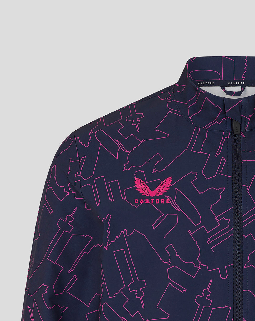 Navy jacket with pink geometric pattern and brand logo on a light gray background