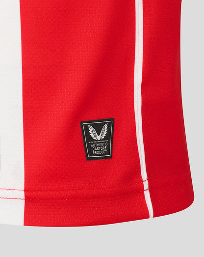Hem view of the Athletic Club retro jersey with an authentic Castore product patch and red side stripe